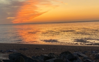 orange sunset over the seashore and beach. Excitement expansion.