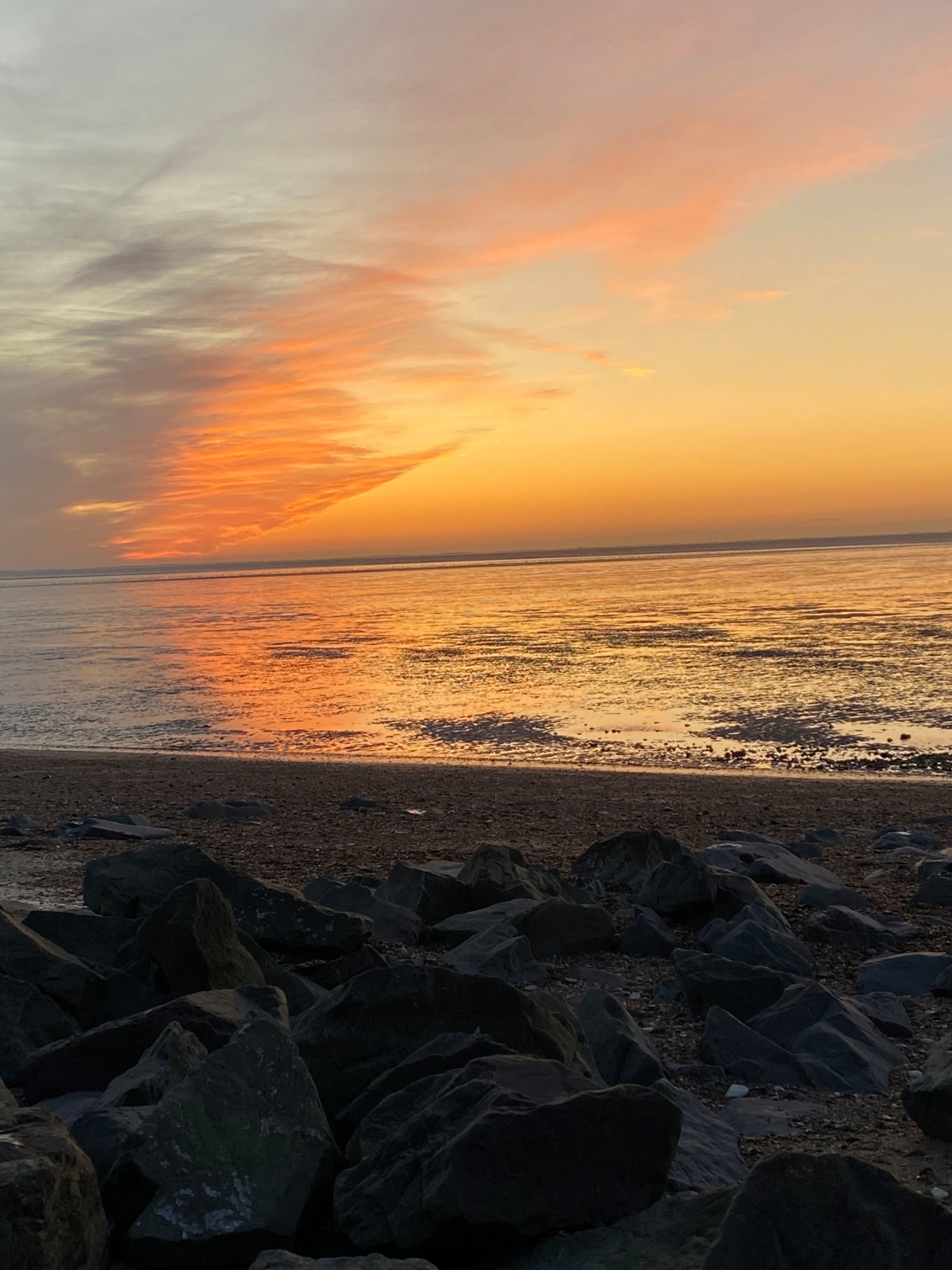 an orange sunset over the sea and beach: excitement expansion